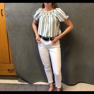 White blouse with blue, green, and navy stripes.